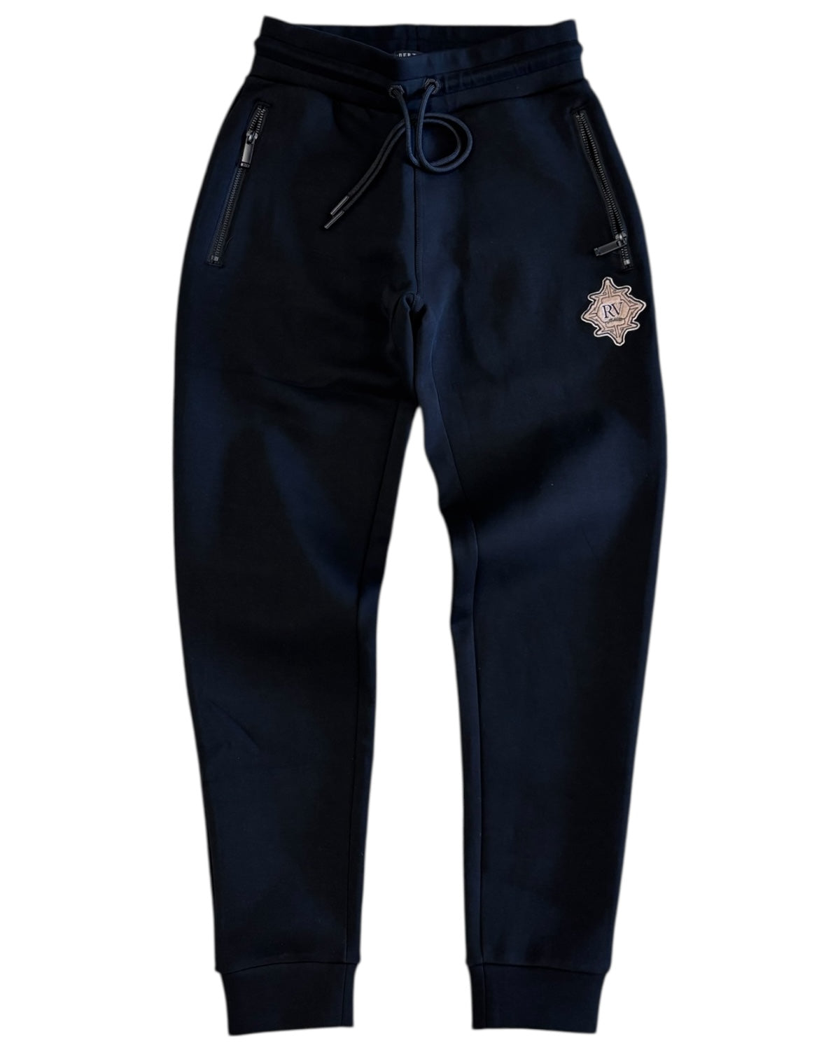 Navy blue jogger pants with a star-shaped patch on a white background