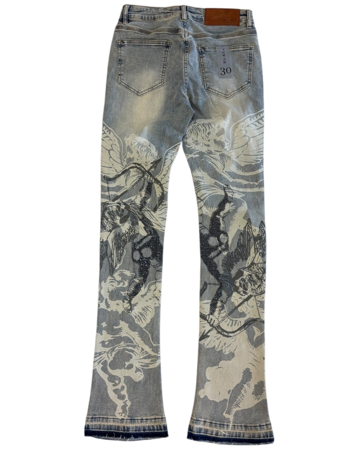 Blue jeans with black and white floral patterns on a white background