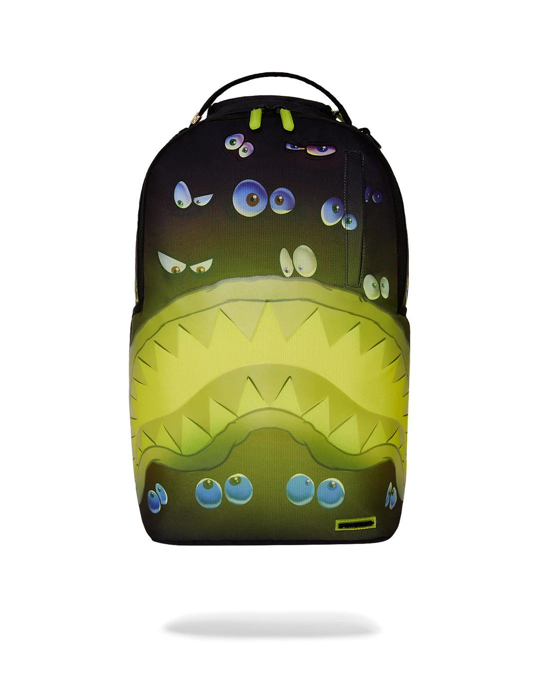 sprayground backpack with pairs of eyes all over and a neon yellow shark mouth design
