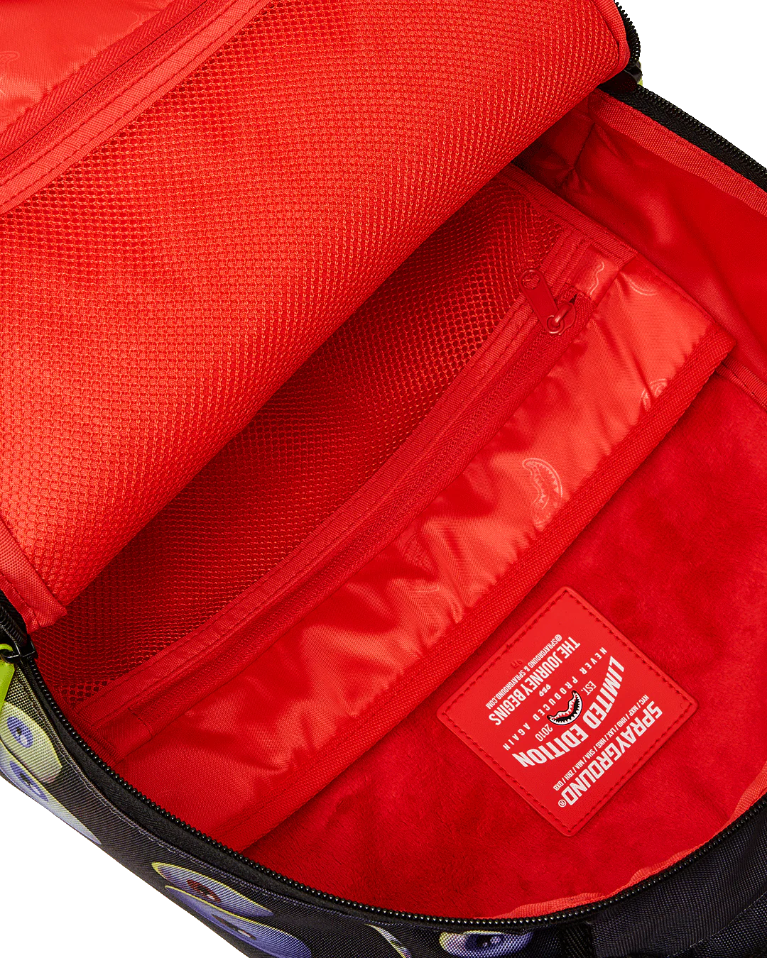 Red interior of a bag with a visible brand label.
