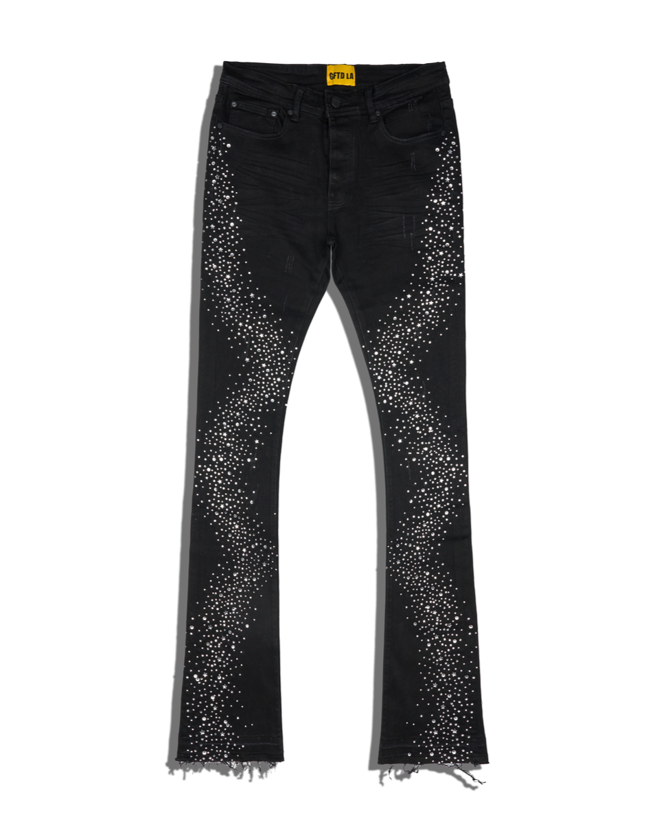 Black jeans with silver studs on a white background