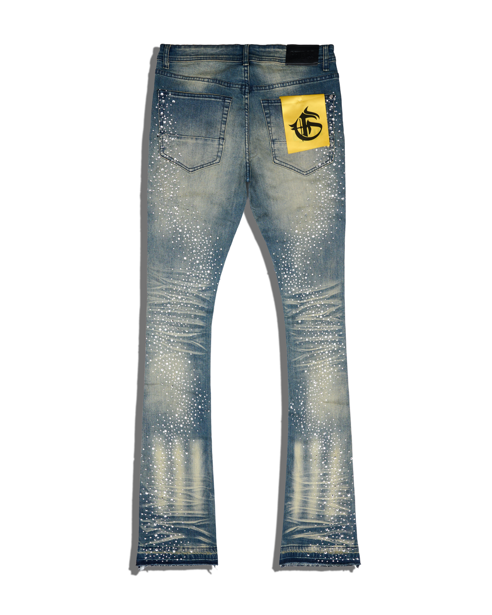 Blue jeans with a yellow label on a white background
