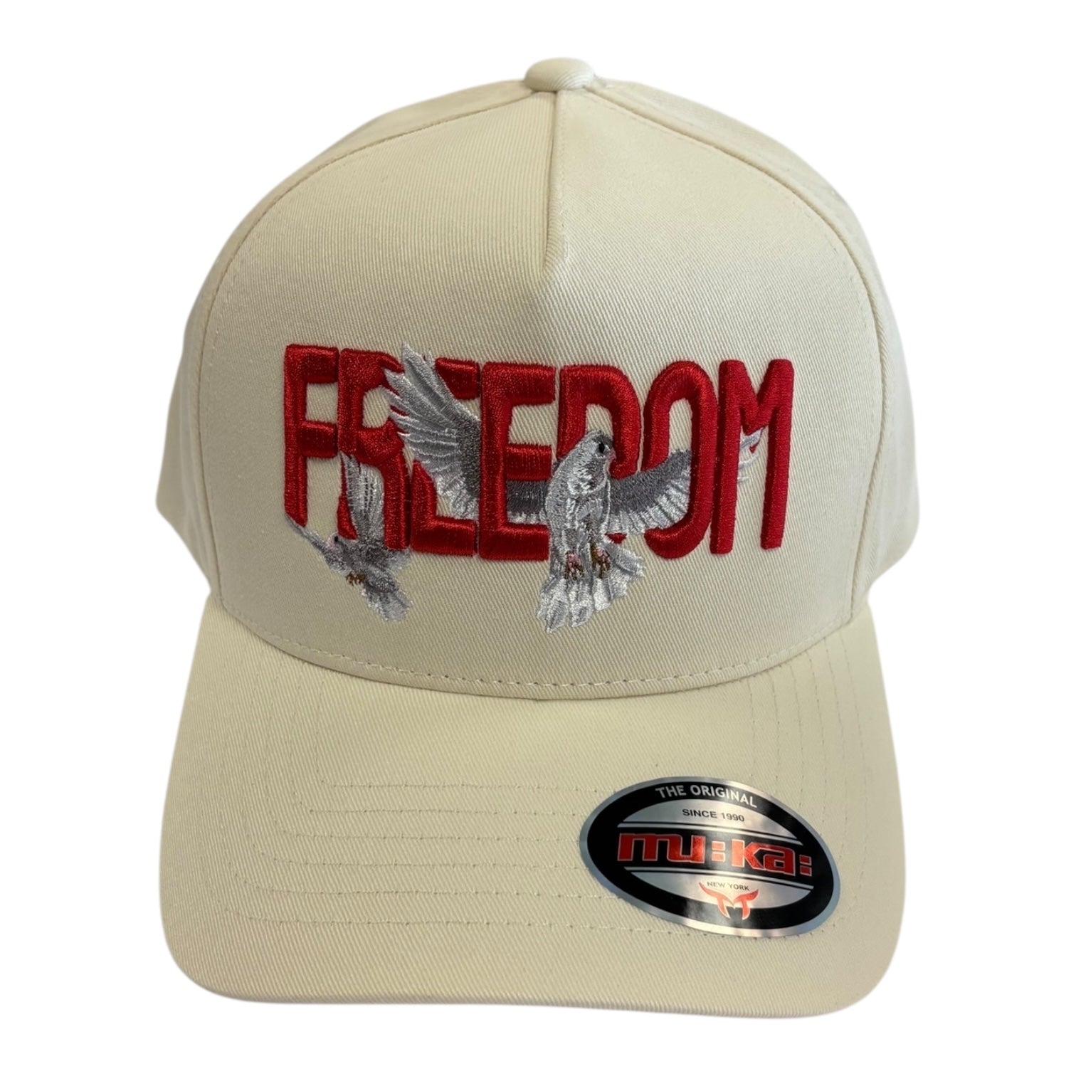 Beige cap with 'Freedom' in red and dove designs on a white background