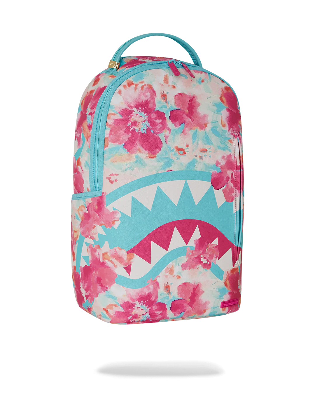 Sprayground Backpack with watercolor pastel floral design and shark mouth graphic on a white background
