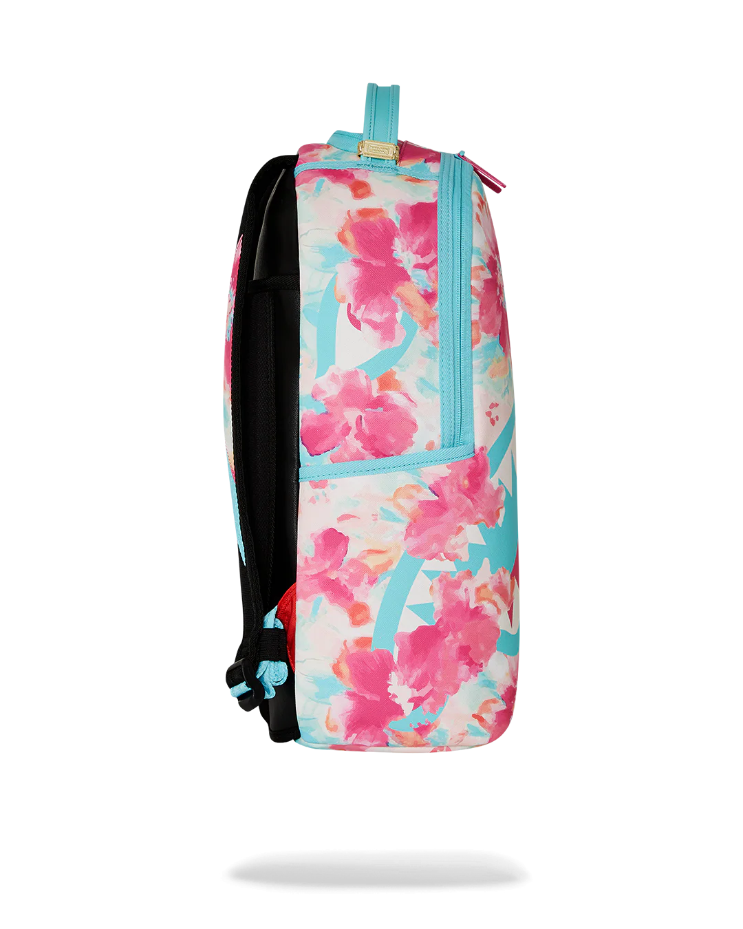 Sprayground Backpack with watercolor pastel floral design and shark mouth graphic on a white background