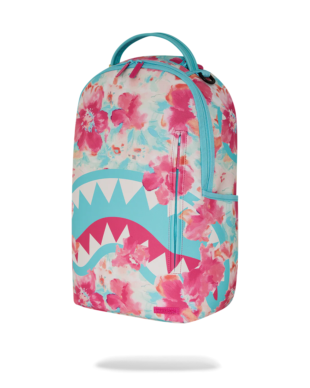 Sprayground Backpack with watercolor pastel floral design and shark mouth graphic on a white background
