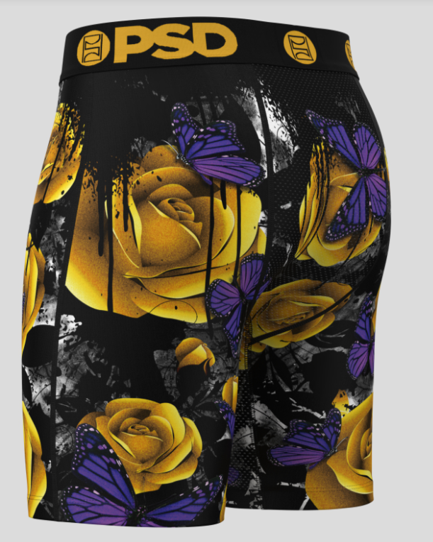 Shorts with yellow roses and purple butterflies design on a black background, featuring the brand 'PSD'.