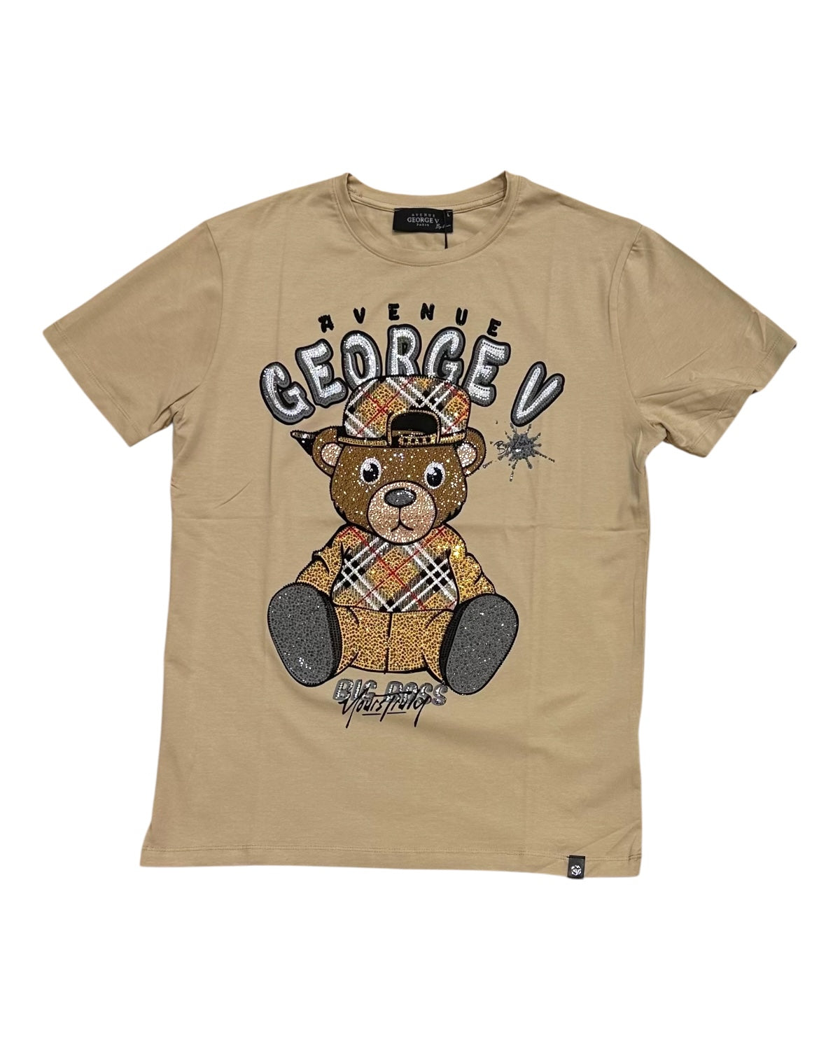 Beige t-shirt with teddy bear graphic and 'Avenue George V' text on a white background