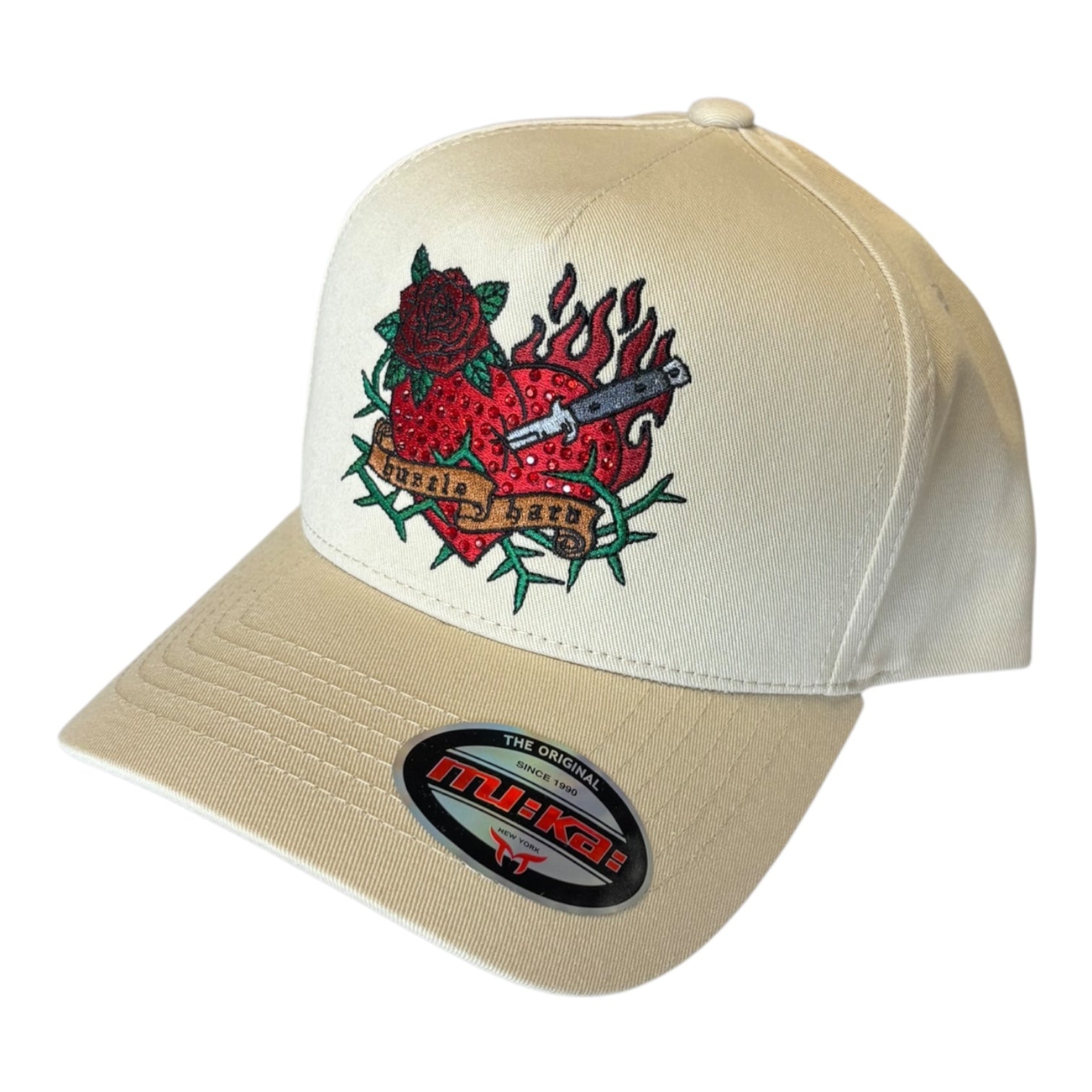 Beige cap with red heart and rose design on a white background