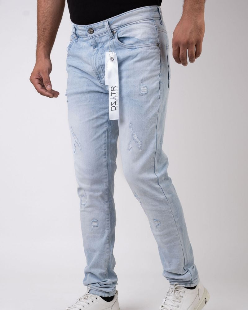 Light blue jeans with a brand tag on a white background