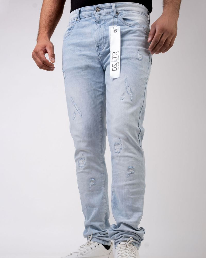 Light blue jeans with a brand tag on a white background