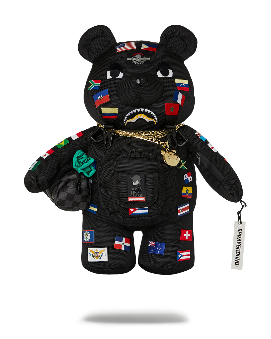 Black bear plush toy with various patches and a gold chain on a white background