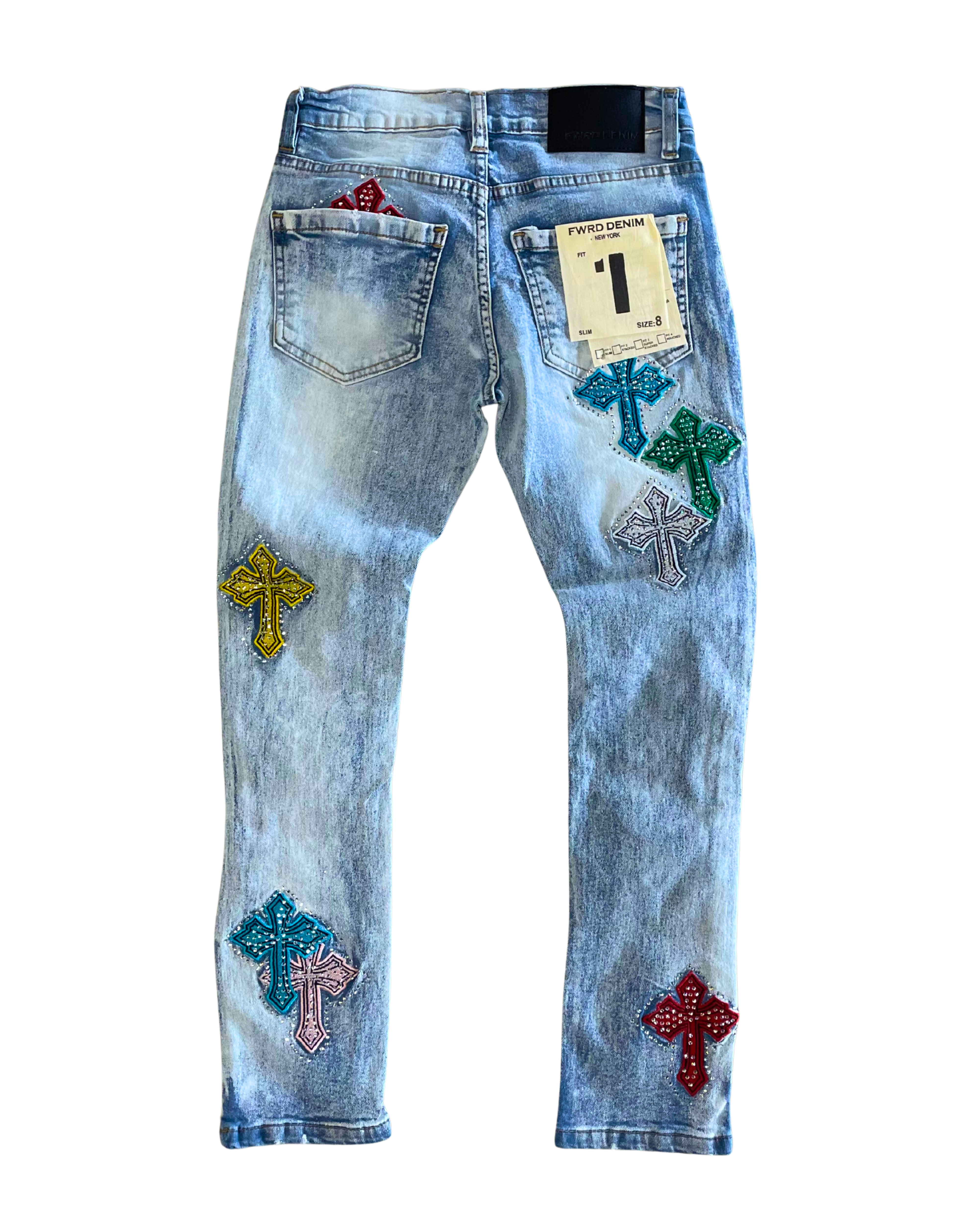 Light blue jeans with colorful cross patches on a white background