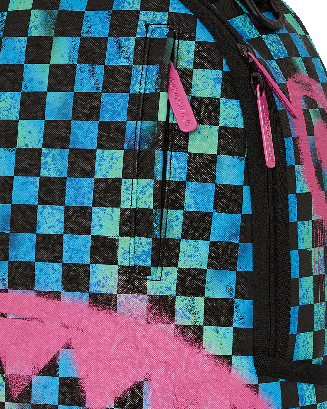 close up of a Checkered backpack with pink zippers and logo on a blue and black background by sprayground