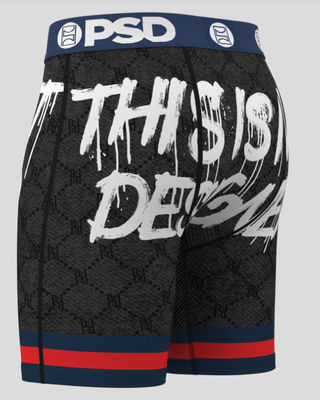 Black athletic shorts with 'This is Dedication' text and PSD branding on a gray background