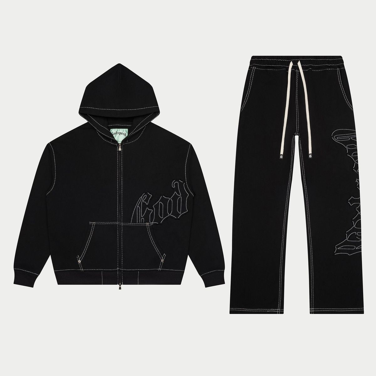 Black hoodie and pants set with white graphics on a light gray background