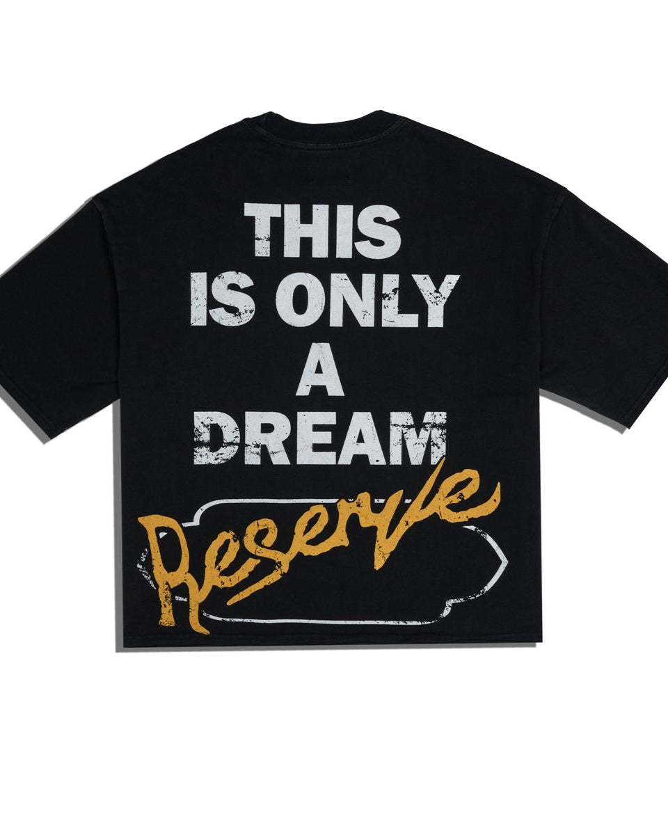 Black t-shirt with white and yellow text on a white background