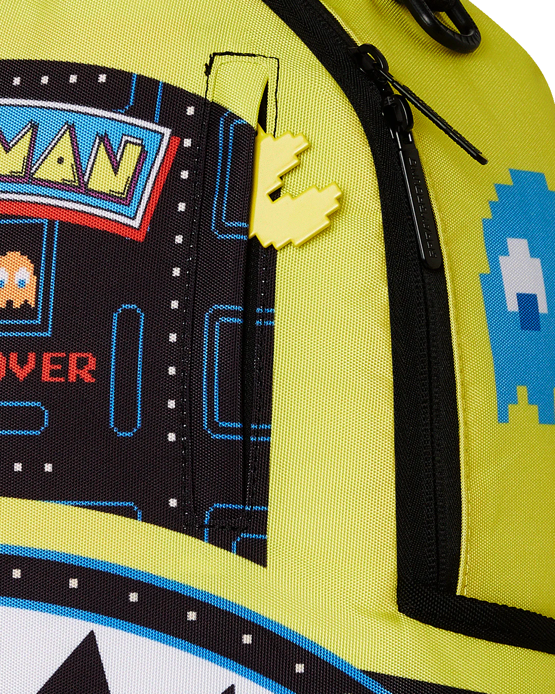 Pac-Man themed sprayground backpack with colorful design on a white background