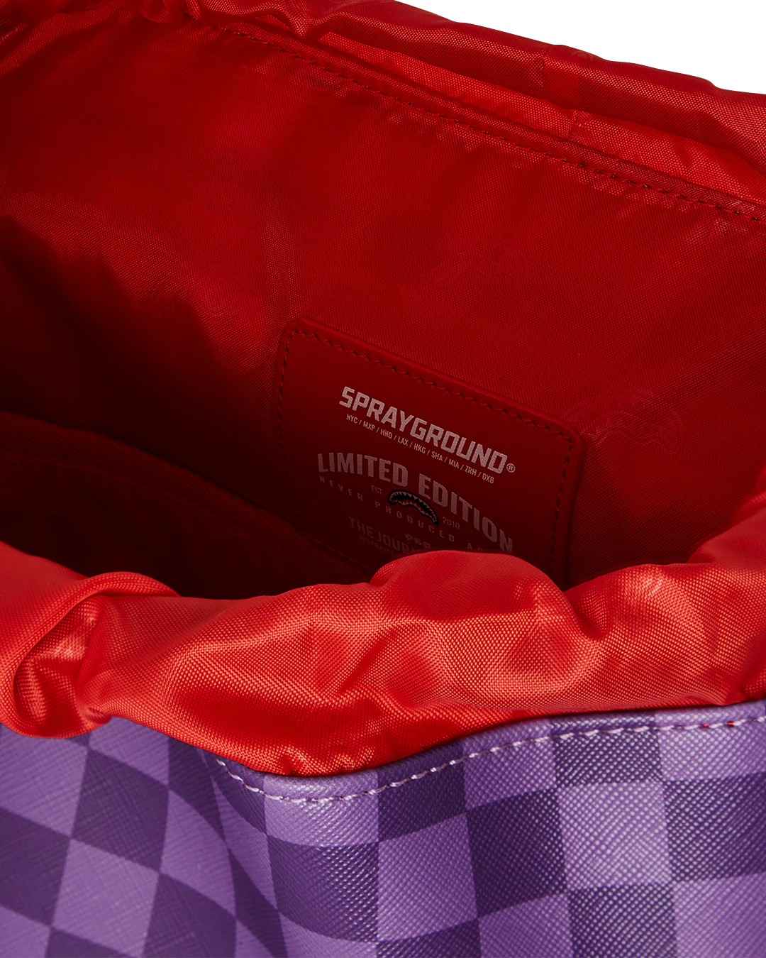 all systems go monte carlo spraygroung backpack with checker board pattern adn shark mouth design in purple