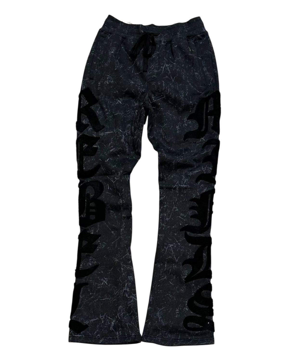 Black flared pants with text design on a white background