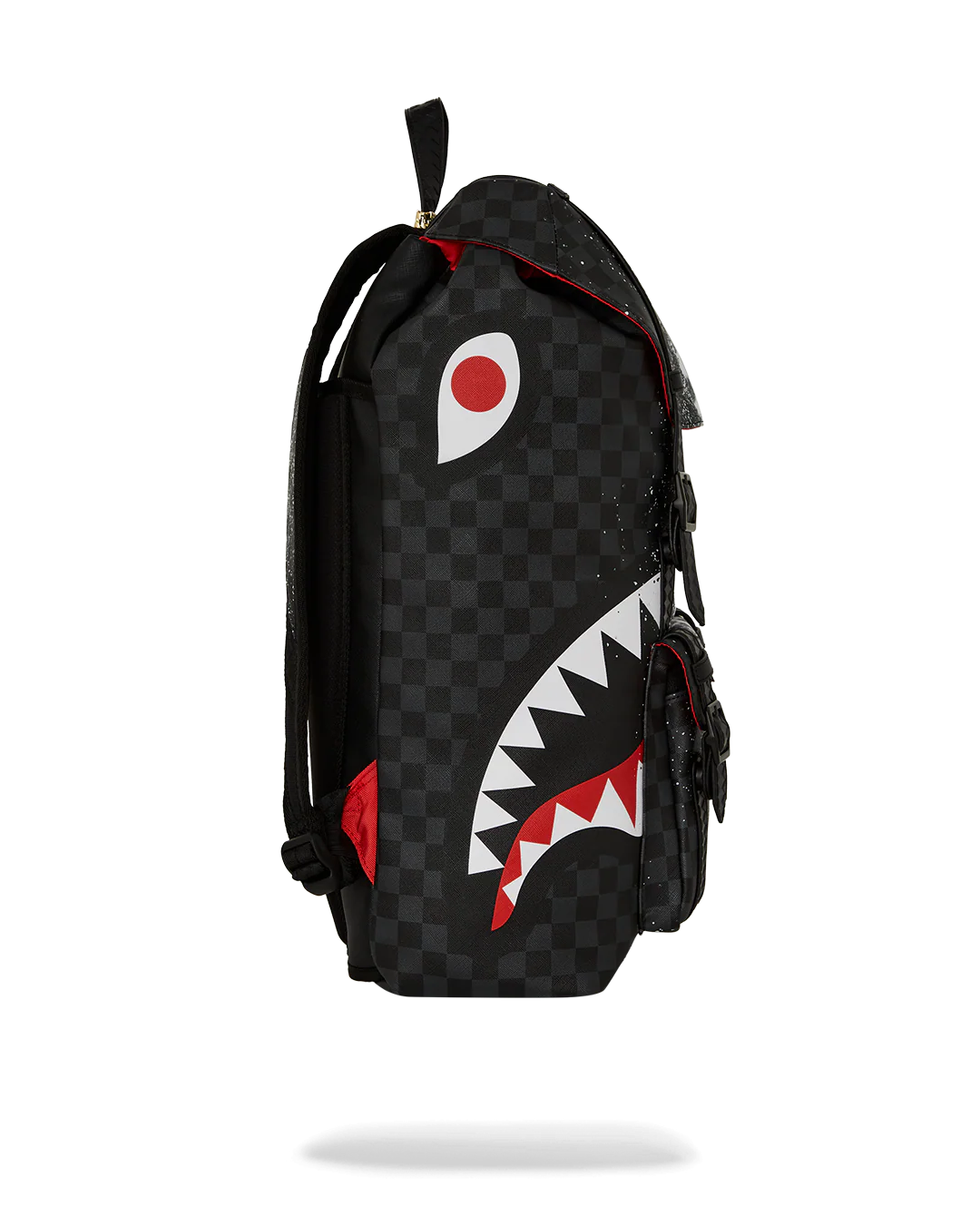 Black and white checkered backpack with a shark logo on a white background by sprayground