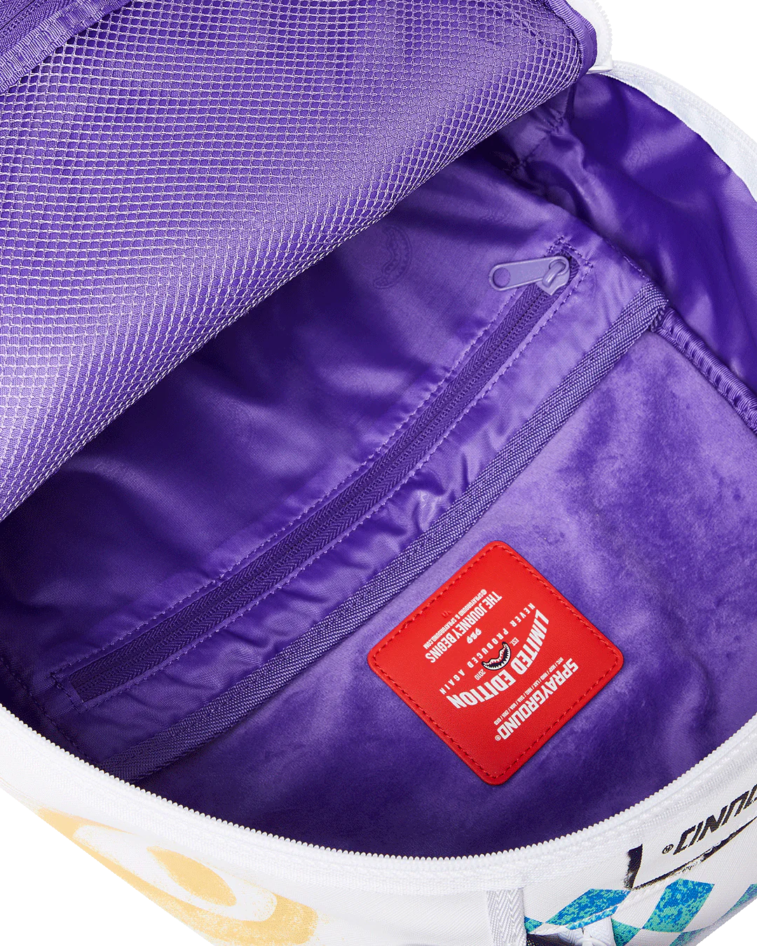 Close-up of a purple bag interior with a red label and white and yellow accents.