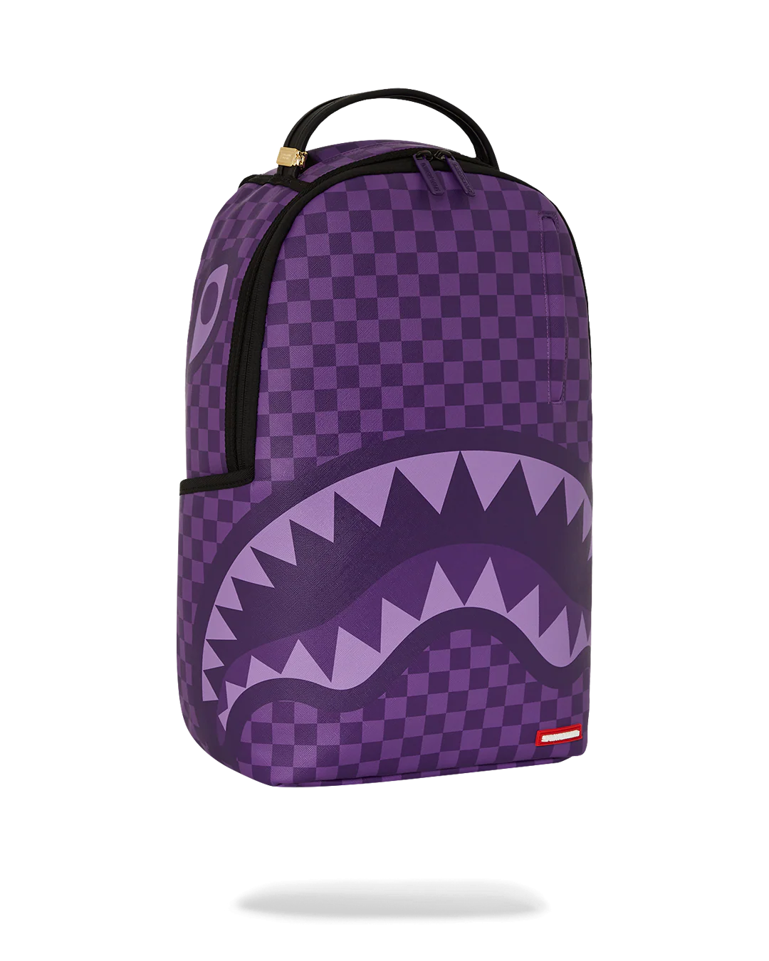 Purple checkered backpack with shark mouth design on a white background by sprayground