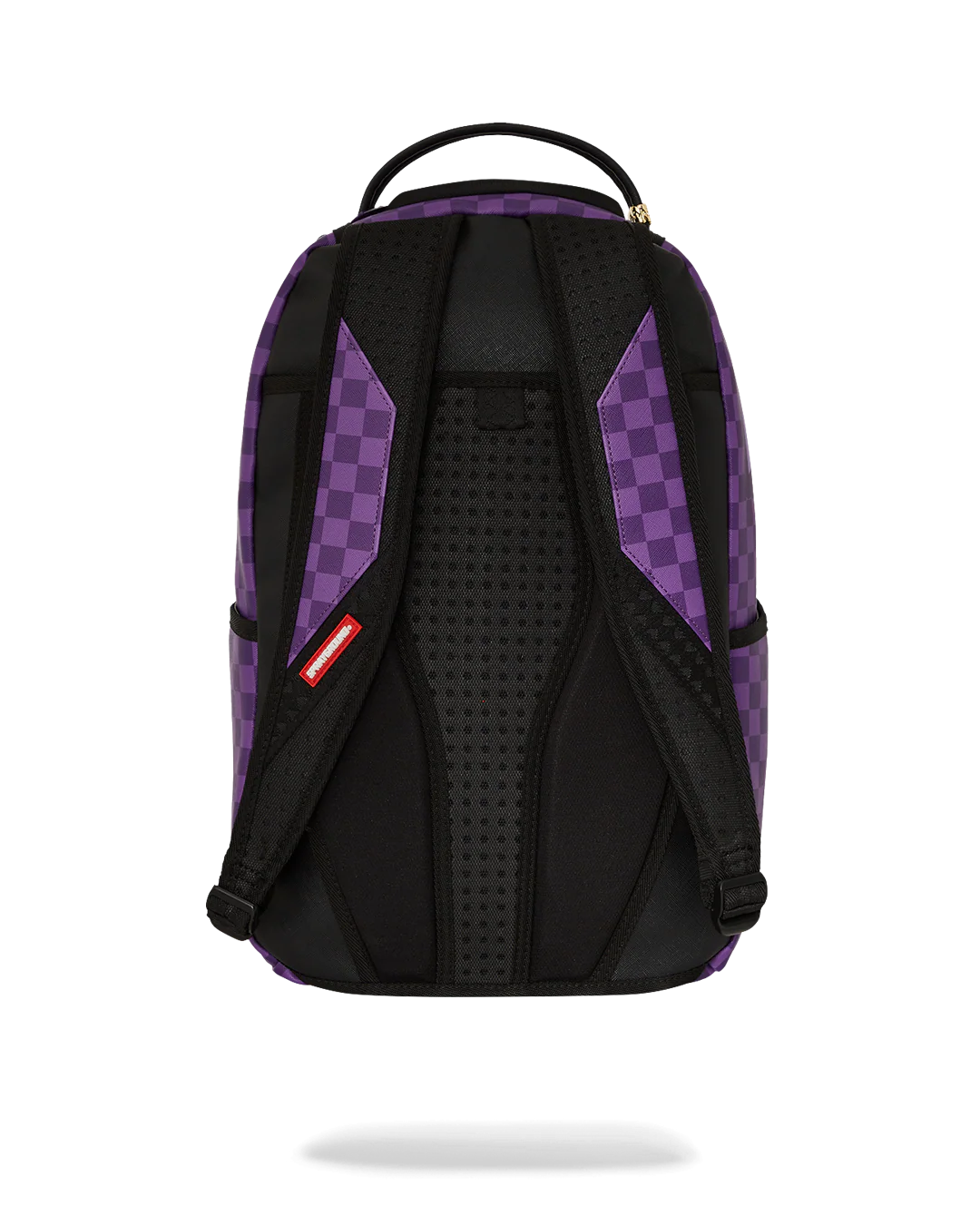 Purple checkered backpack with shark mouth design on a white background by sprayground