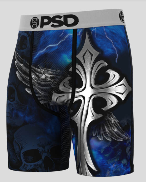 Shorts with a cross and wing design on a blue background, featuring the brand 'PSD'.
