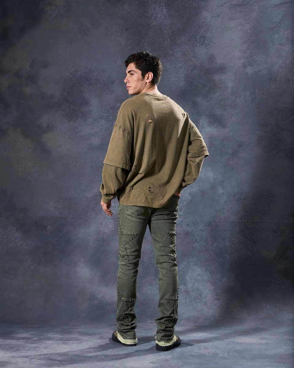 W by waimea star studded flare stacked jeans in olive green with silver-black metallic studs forming stars all over