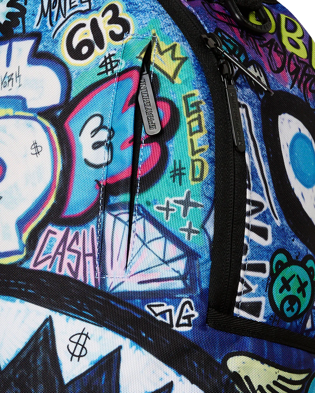 Close-up of a colorful backpack with graffiti-style designs and text.
