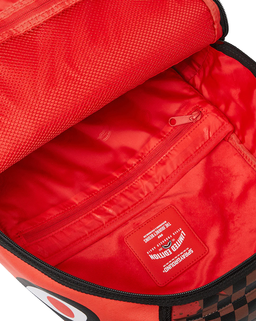 Red bag interior with a visible brand logo on a white background