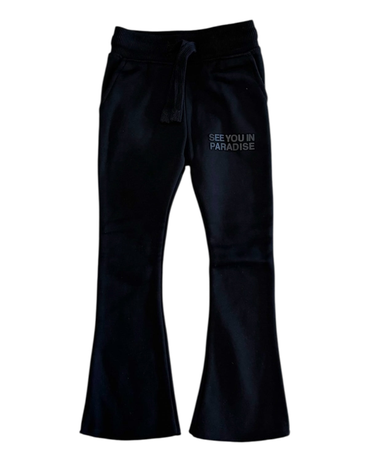 Black pants with 'SEE YOU IN PARADISE' text on a white background