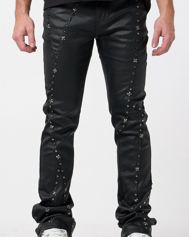 Black leather pants with decorative studs on a white background