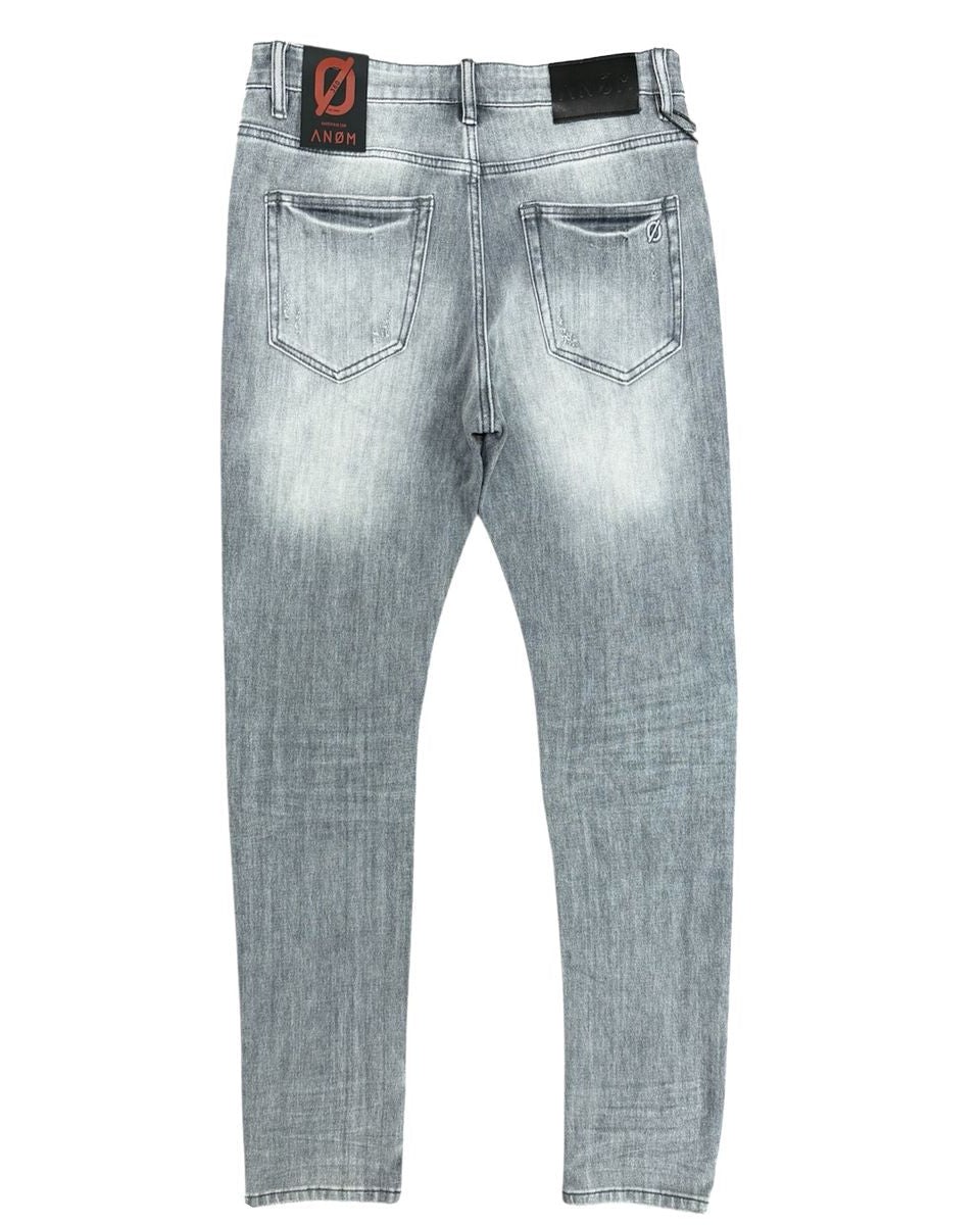 Light gray jeans with brand label on a white background
