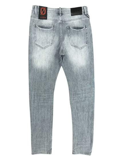 Light gray jeans with brand label on a white background