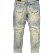 Distressed blue jeans on a white background