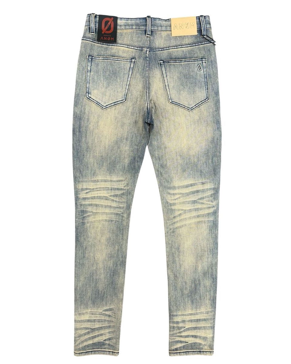 Distressed blue jeans on a white background