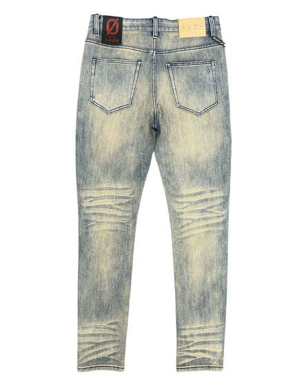 Distressed blue jeans on a white background