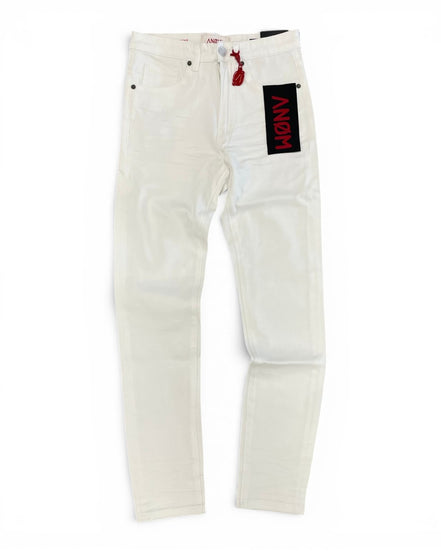 White jeans with a black and red patch on a white background