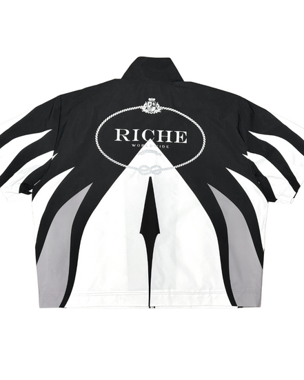 Black and white jacket with 'Riche' branding on a white background