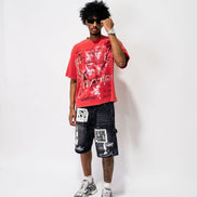 Person wearing a red graphic t-shirt and black shorts with white text on a white background