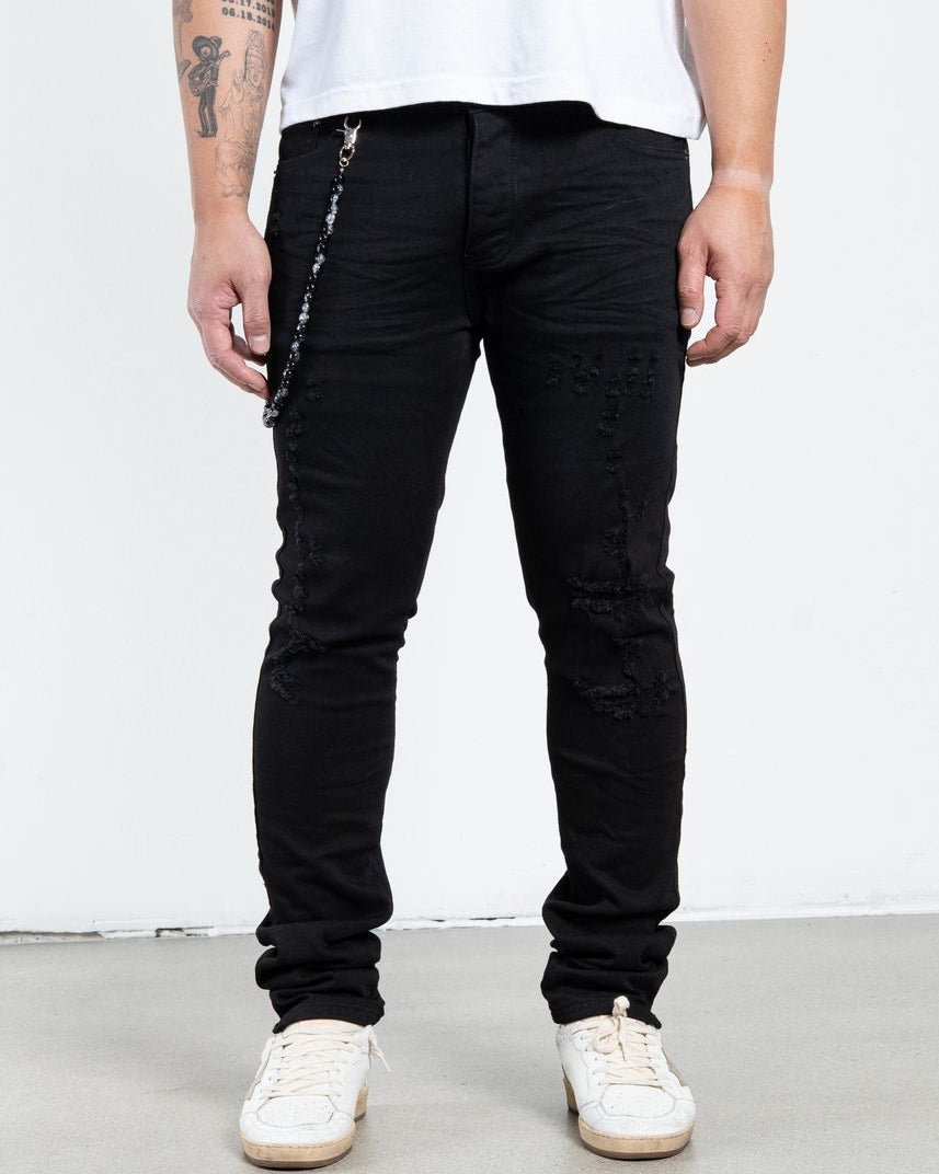 Allan Distressed Skinny Jeans