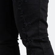 Allan Distressed Skinny Jeans