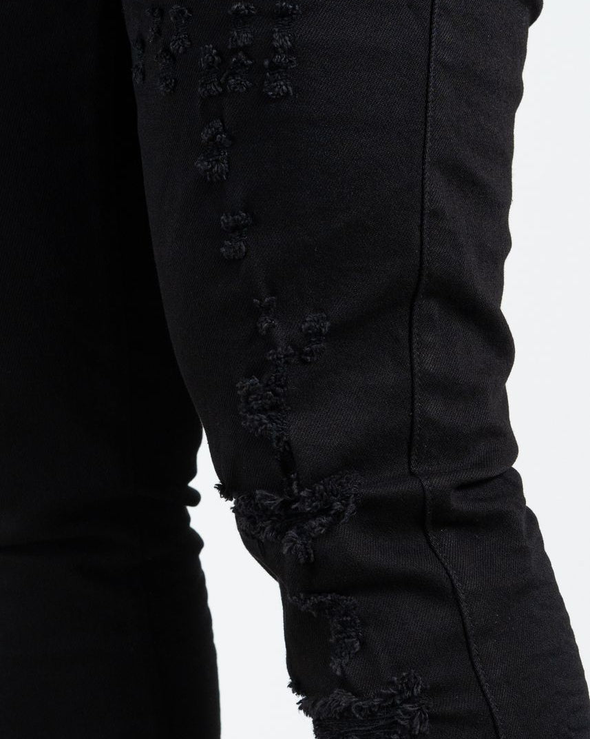 Allan Distressed Skinny Jeans