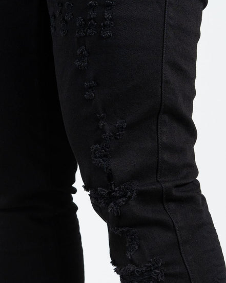 Allan Distressed Skinny Jeans