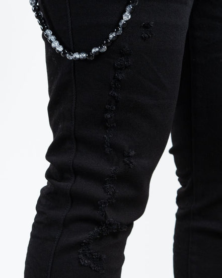 Allan Distressed Skinny Jeans