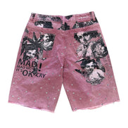 Pink shorts with graphic designs and text on a white background