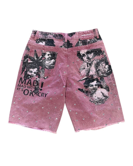 Pink shorts with graphic designs and text on a white background