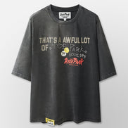 Black t-shirt with graphic text and logos on a light gray background
